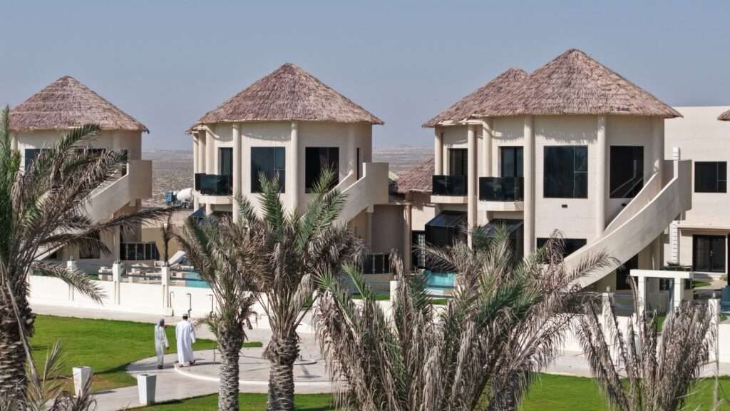 واجهة شاليهات منتجع شاطئ دانا بأسقفها المميزة – Exterior of DANA Beach Resort chalets with distinctive roofs